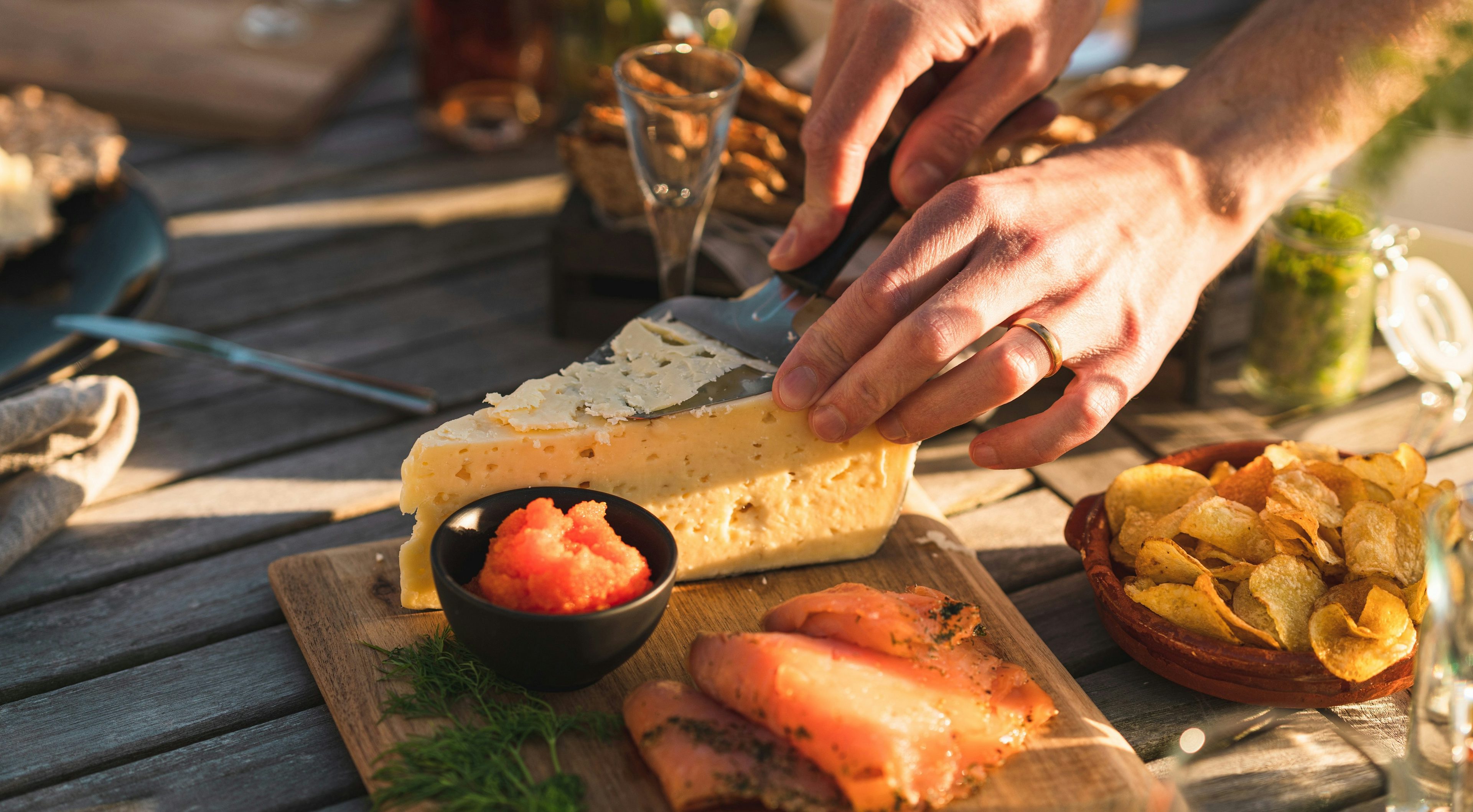 Someone slicing cheese